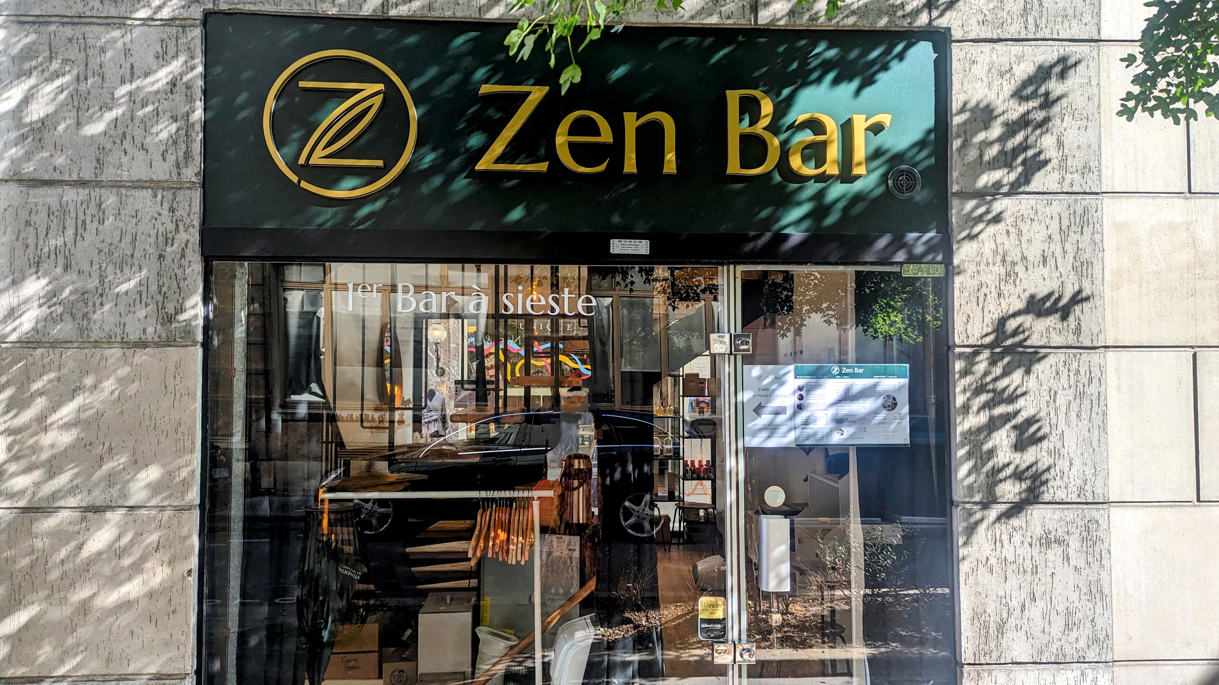 The dark green storefront of Zen Bar located in one of Paris' many covered passageways.
