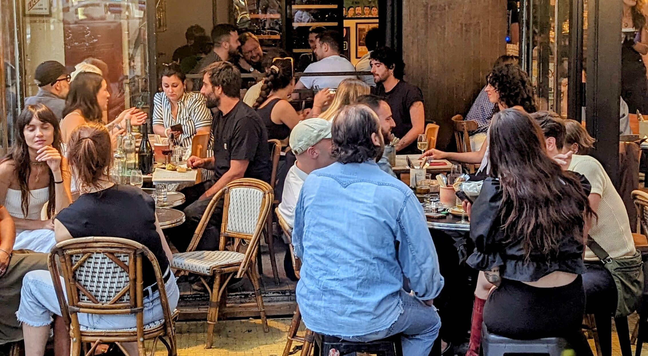 Locals are celebrating 'la rentrée' in a wine bar.