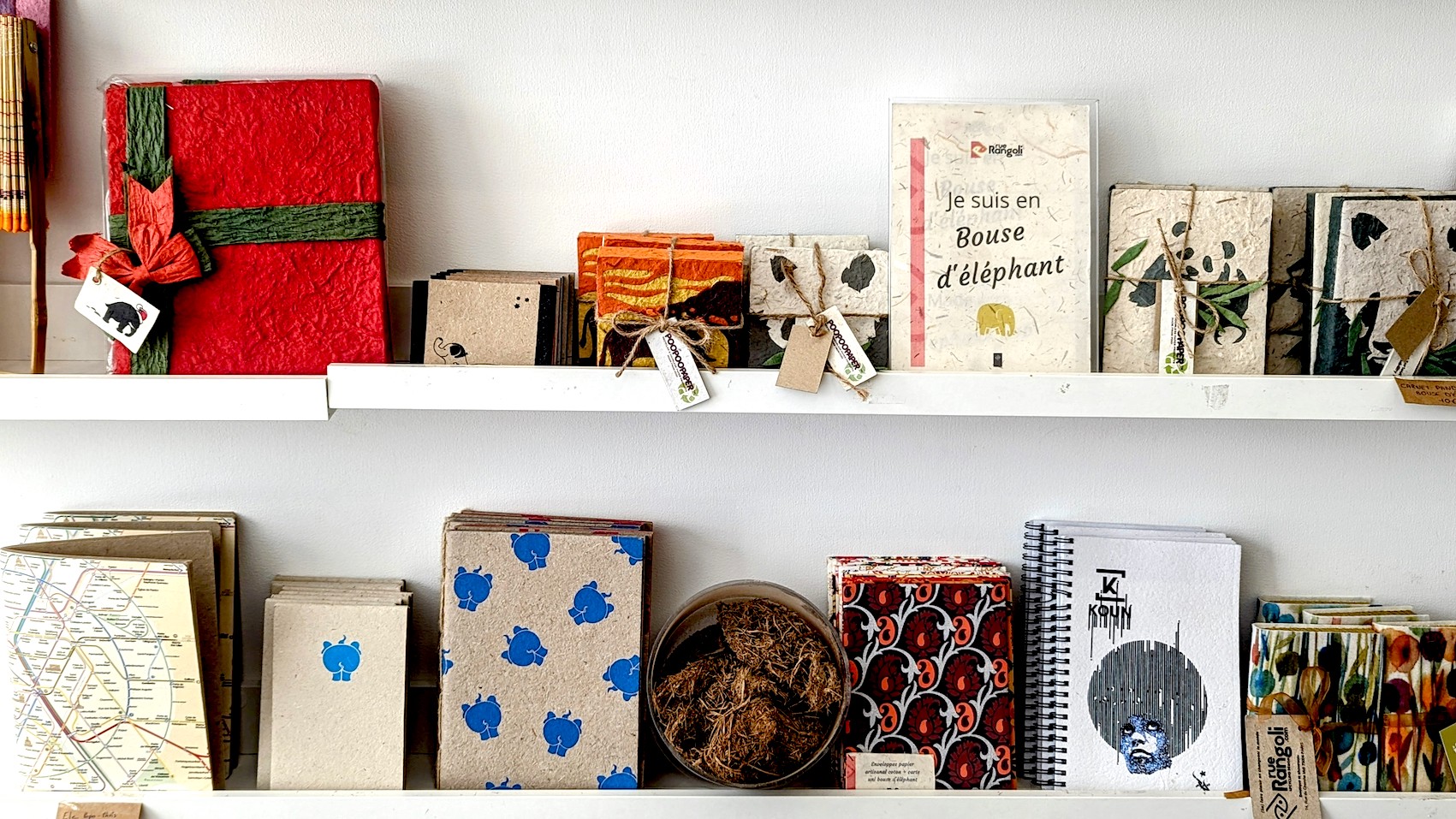 Notebooks made from elephant dung displayed on the shelf at the zero waste upcycling boutique Rue Rangoli.