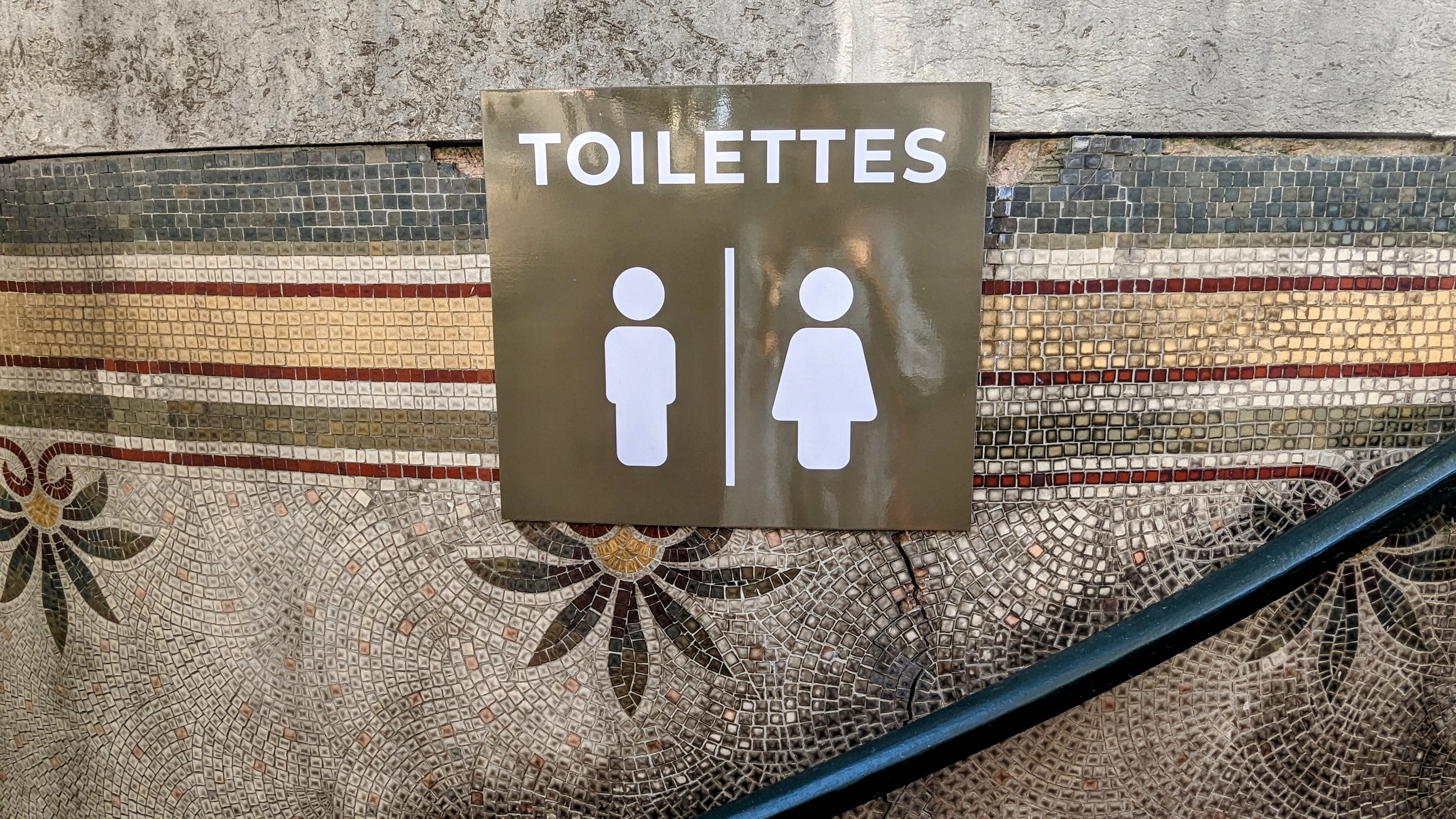 The sign indicating the Art Nouveau public restrooms Le Lavatory at Madeleine.