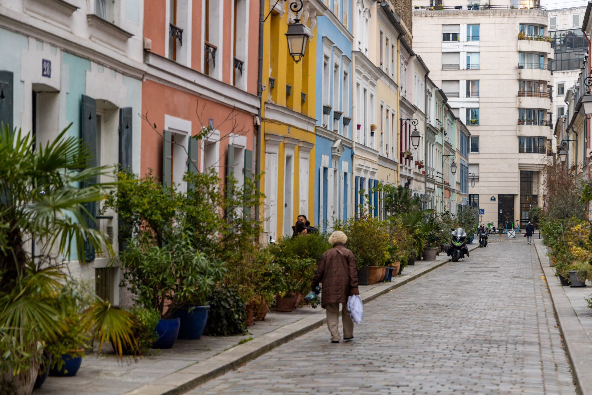 An old lady walks along the colorful Rue Crémieux in the 12 arrondissement in Paris, where she is staying.