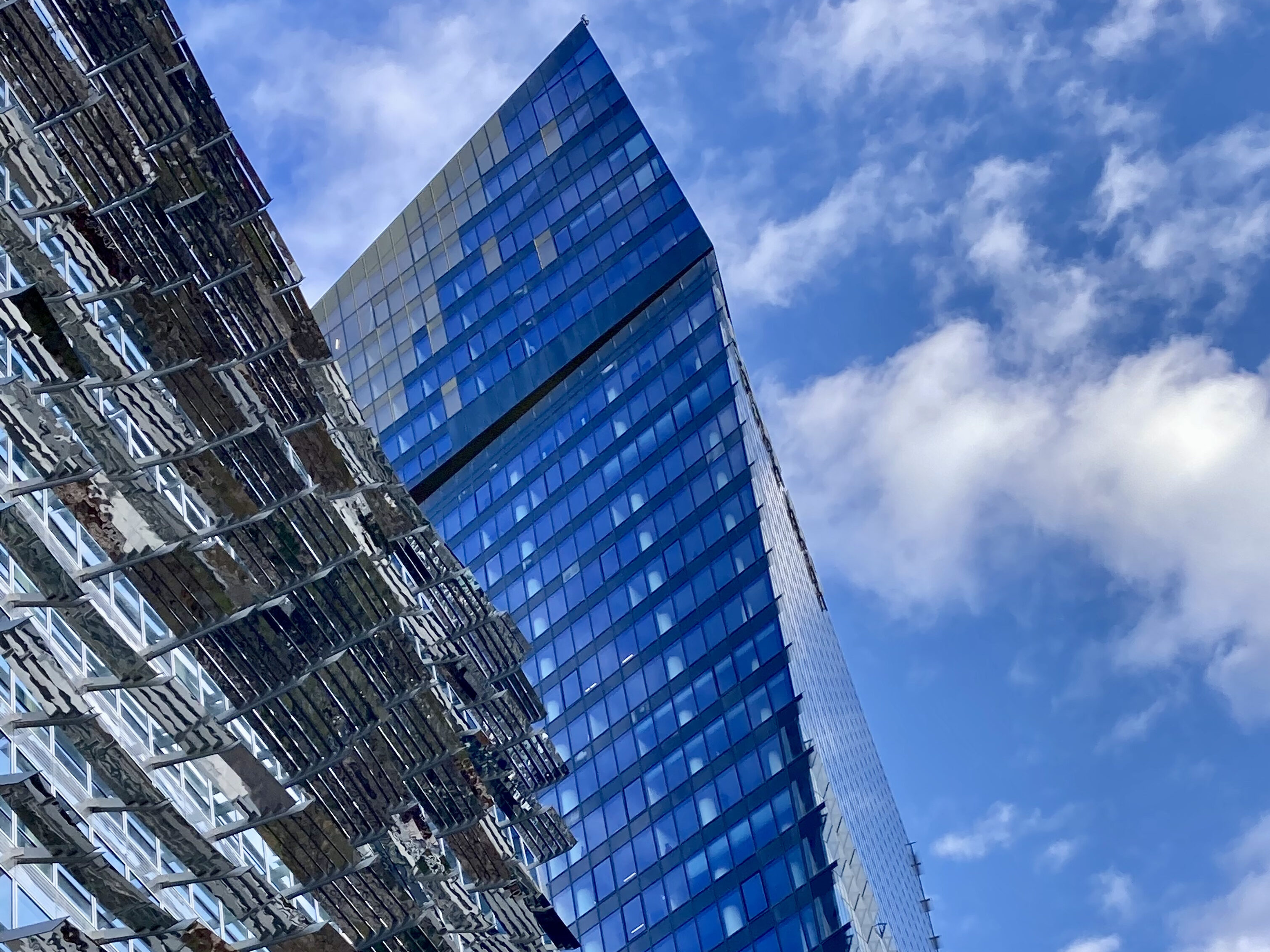 The blue sky reflecting off the Tours Duo towers by architect Jean Nouvel.