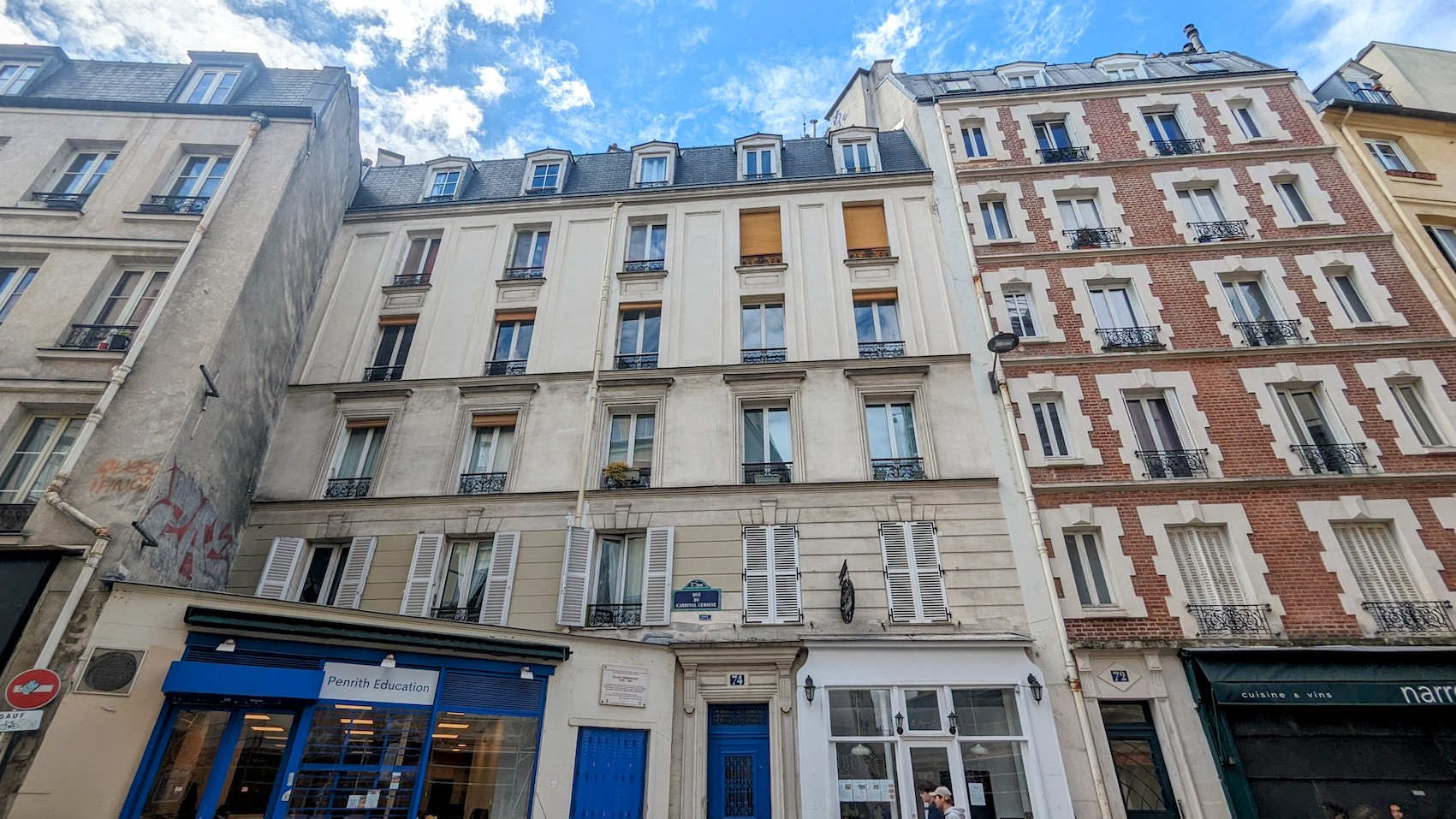 Hemingway's first Paris home viewed from the outside. A sign on the facade of the house refers to the famous resident.