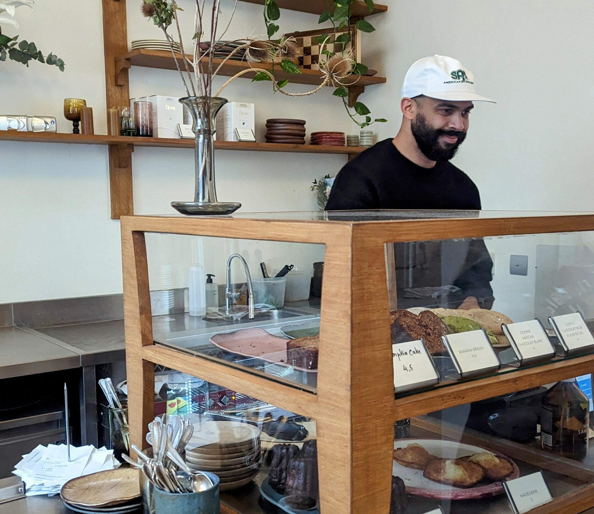 The barista at a typical Parisian coffee shop frequented by bobos.