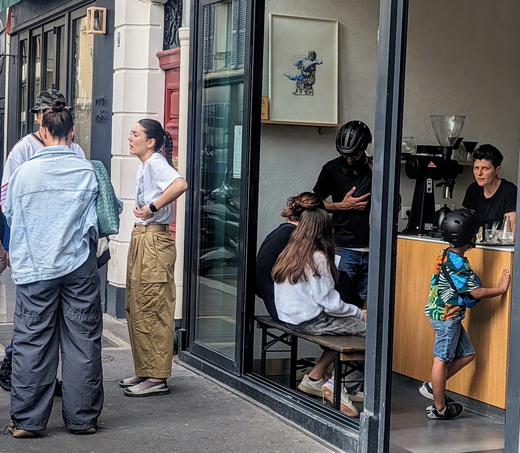 Young Parisians hanging out in a coffee shop in the hip 11th arrondissement of Paris.