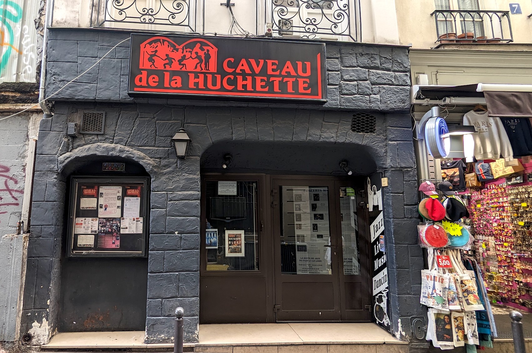 The storefront of the Parisian jazz club Caveau de la Huchette in the Latin Quarter, where a scene from La La Land was filmed.